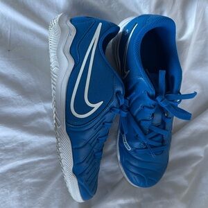 Nike boys shoes.  Size 2.5.  Slightly used.  A beautiful blue.